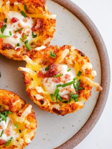 Tater tot potato cups on a plate.