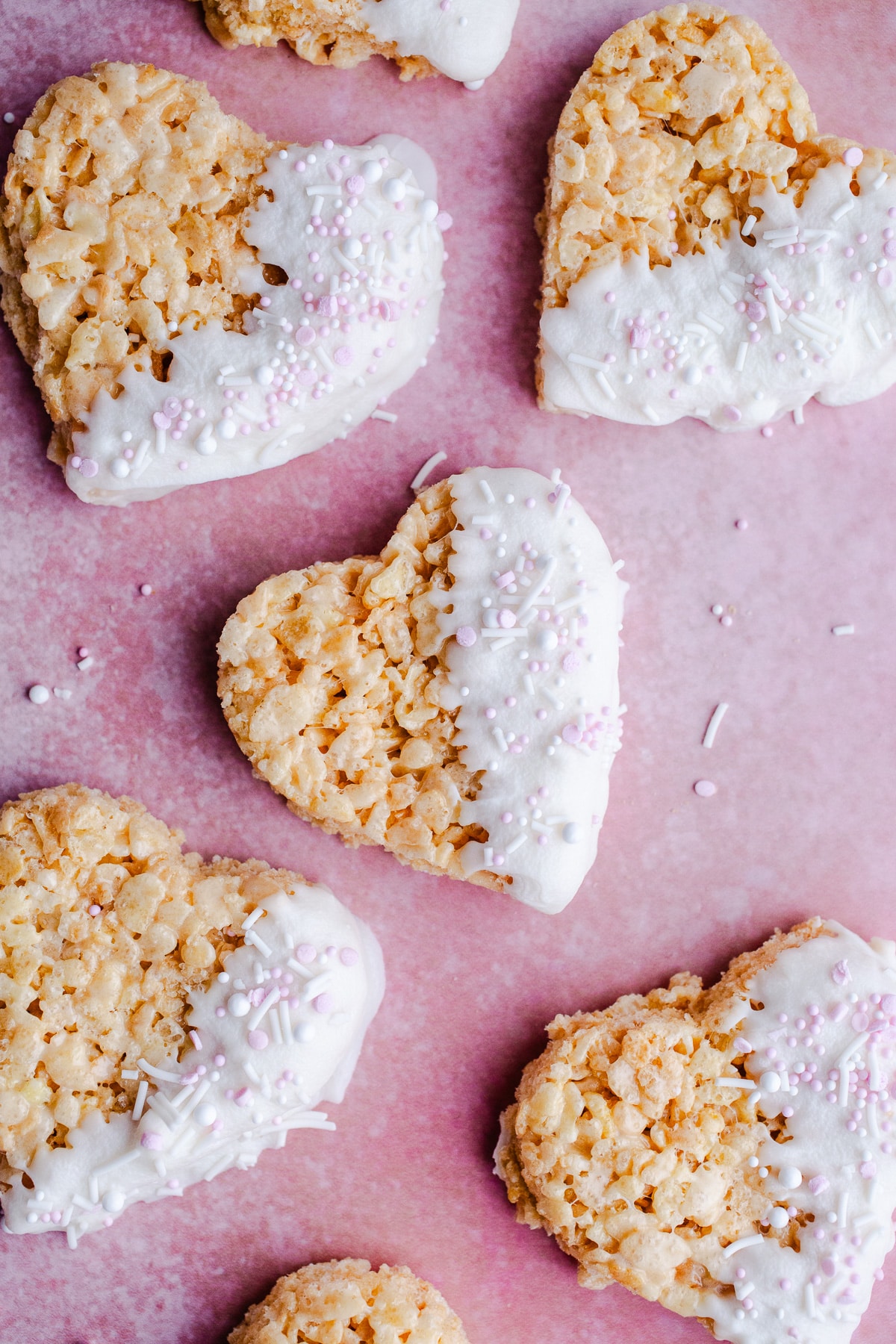 Heart shaped rice krispies treats dipped in white chocolate.