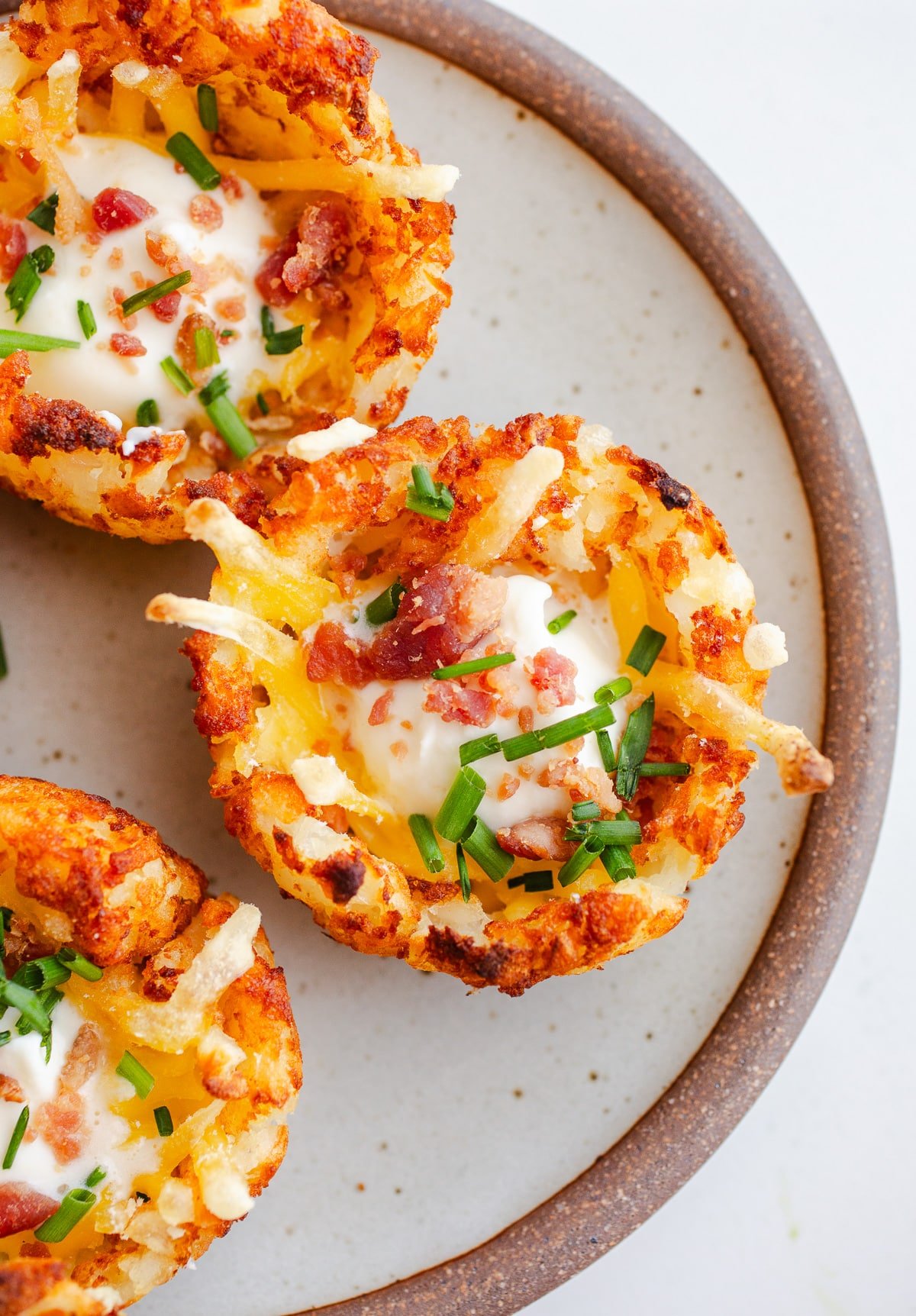 Tater tot potato cups on a plate. 