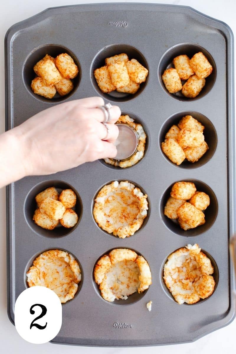 Pressed tater tots in a muffin pan.