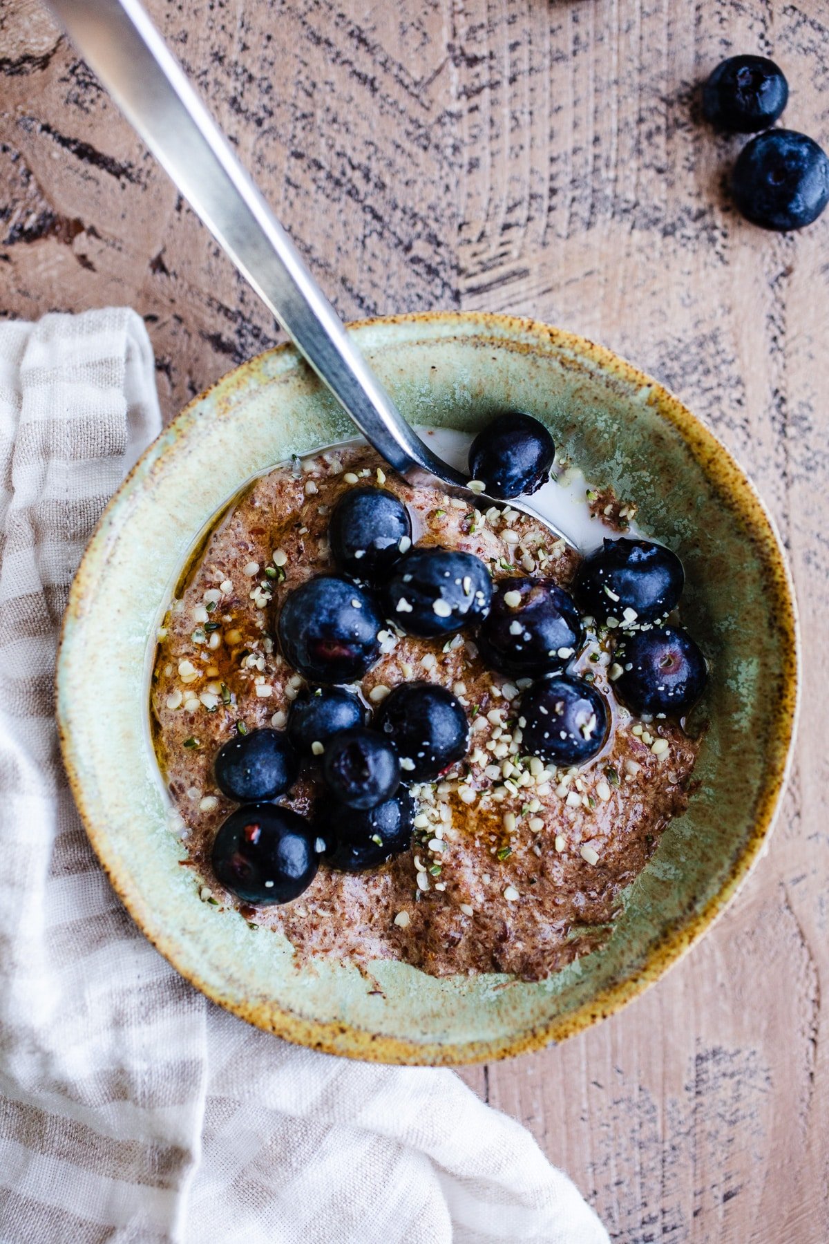 Flax porridge in a bowl with blueberries 