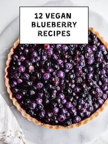 A blueberry pie on a platter.