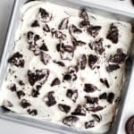 A cake topped with crushed Oreos.