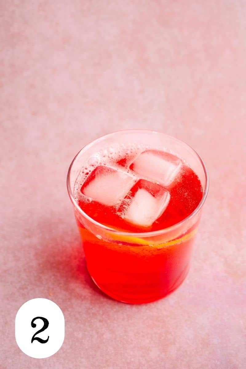 A campari cocktail with ice.