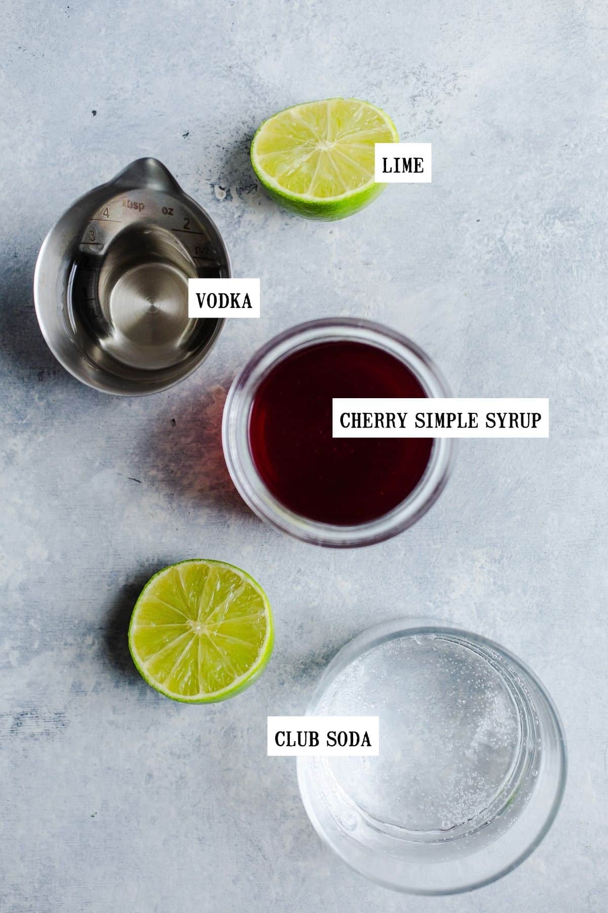 Ingredients for a vodka cherry limeade.