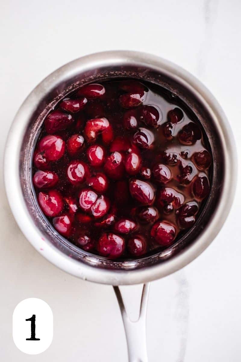 Cherry syrup in a saucepan.