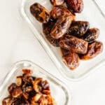 Medjool dates in glass storage containers.
