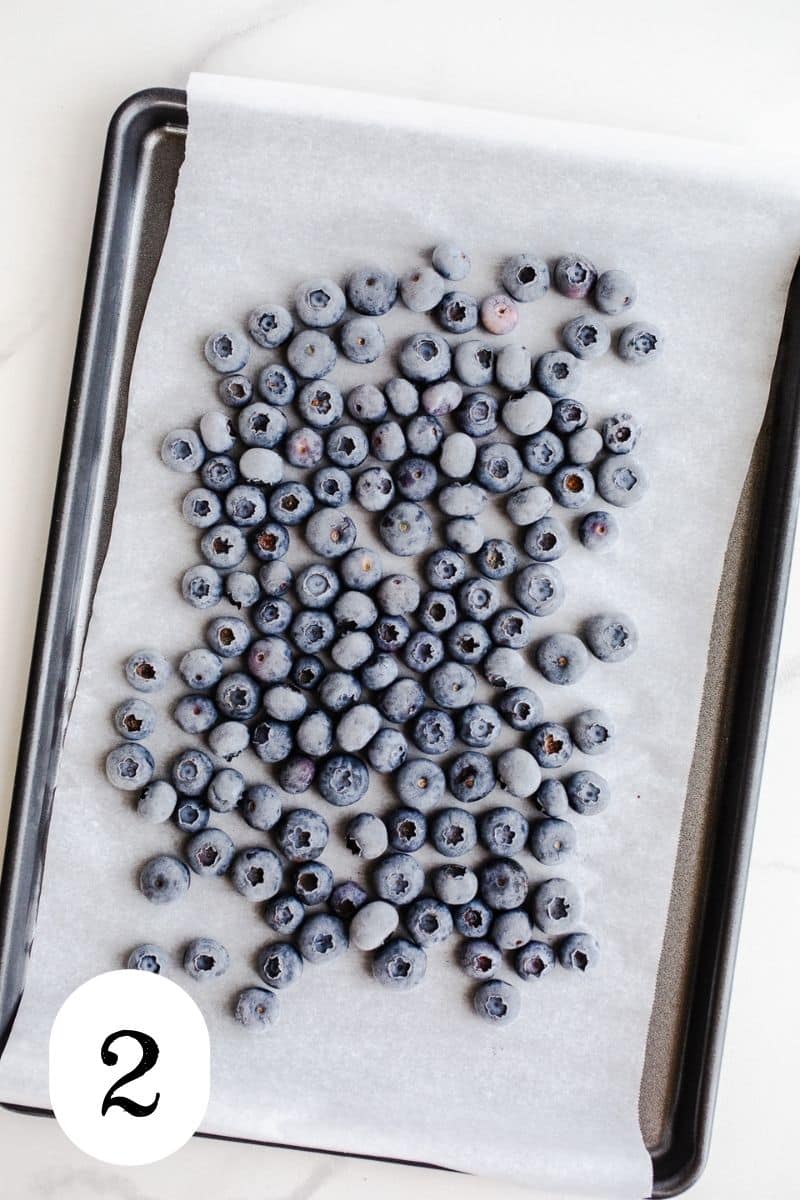 Frozen blueberries on a sheet pan. 