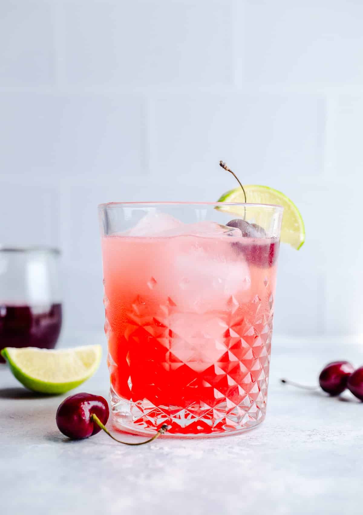 A cherry limeade in a glass.