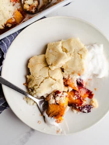 Peach cobbler in a bowl.