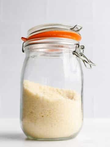 Almond flour in a glass jar.