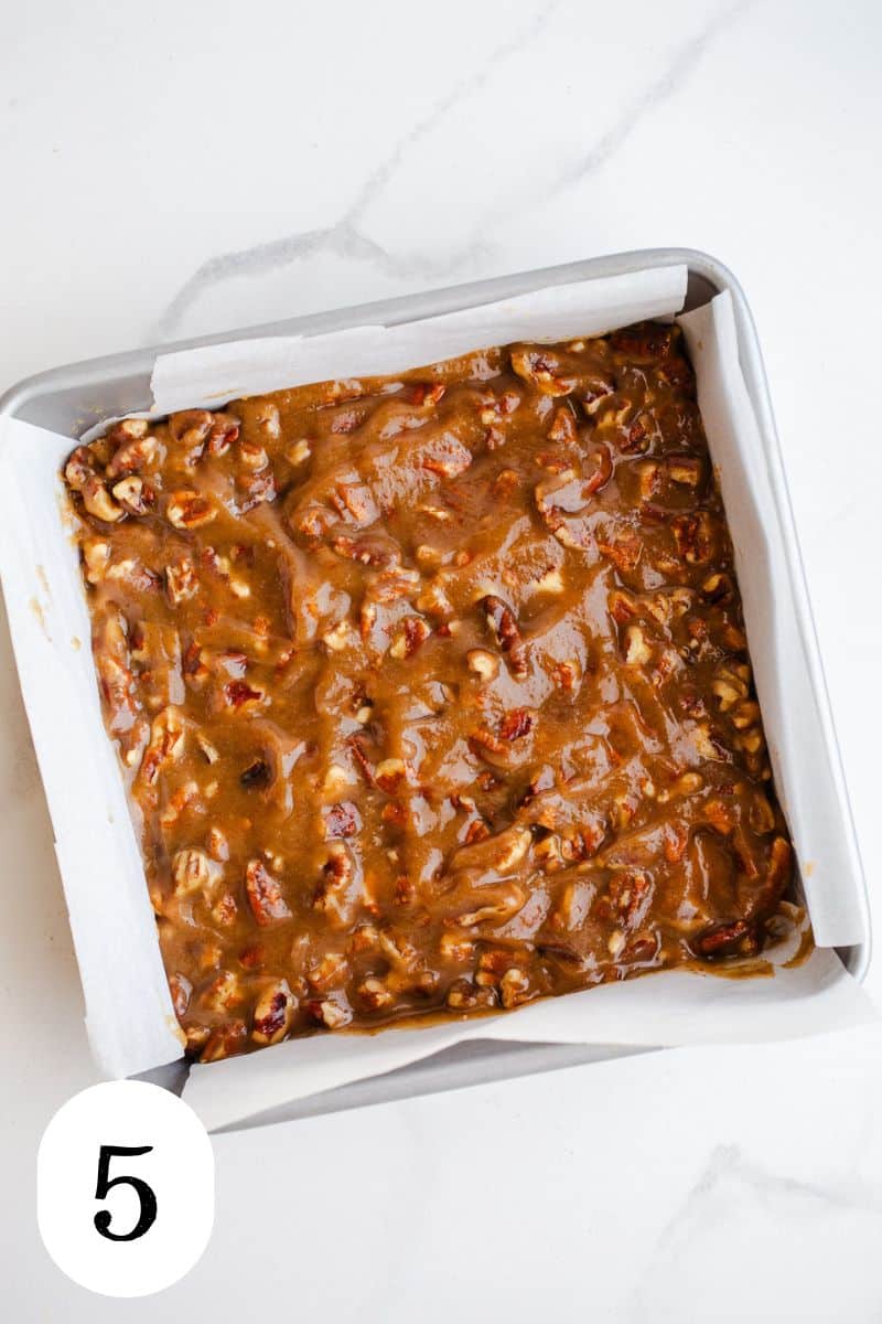 Pecan bars in a square pan.