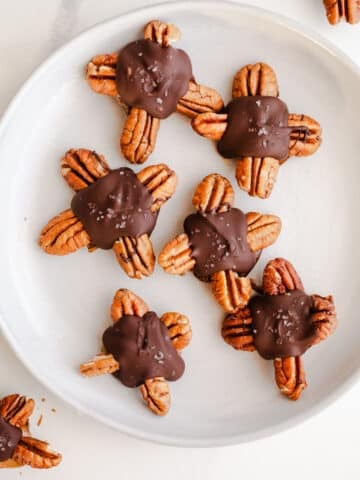 Chocolate pecan candies on a plate.