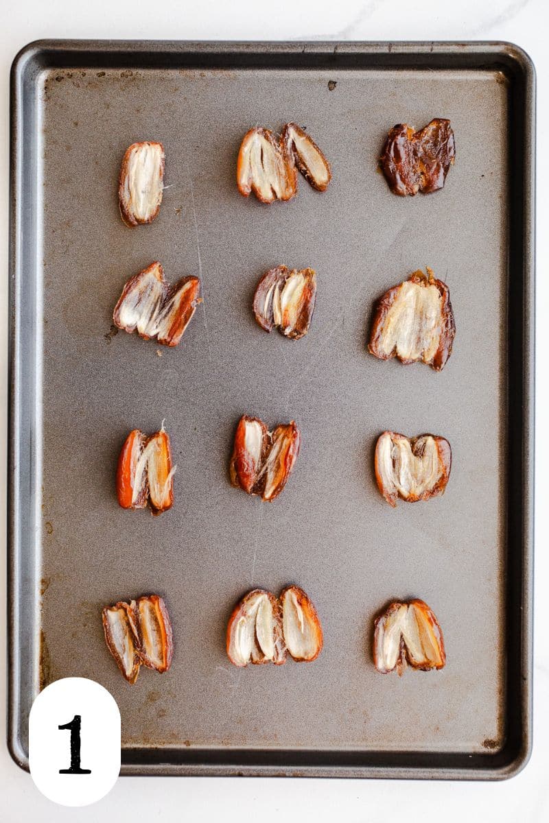 Date halves on a baking sheet.