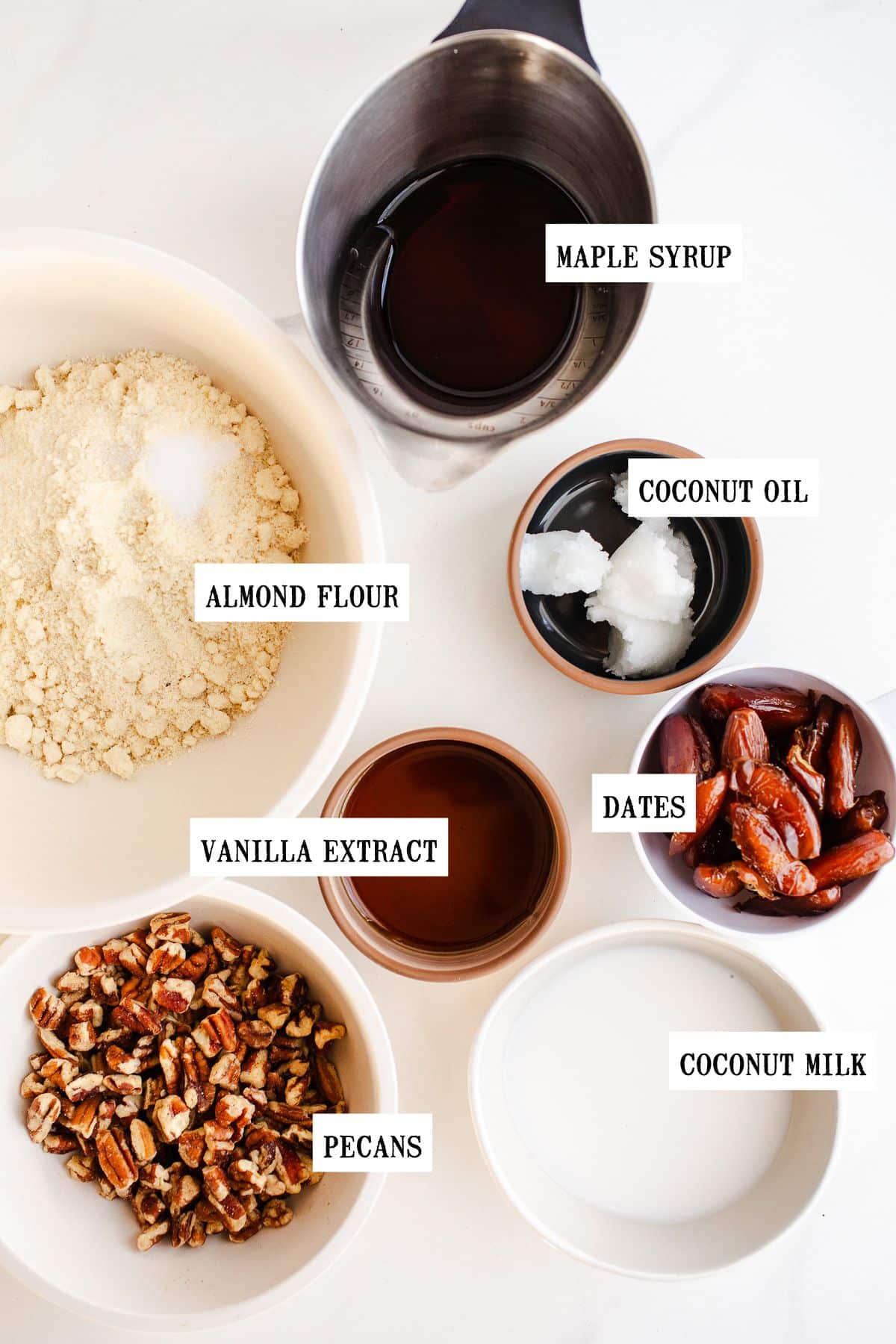 Ingredients to make pecan pie bars in bowls.