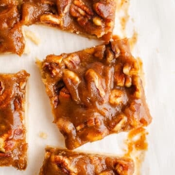 Pecan bars on parchment paper.