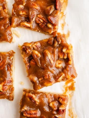 Pecan bars on parchment paper.