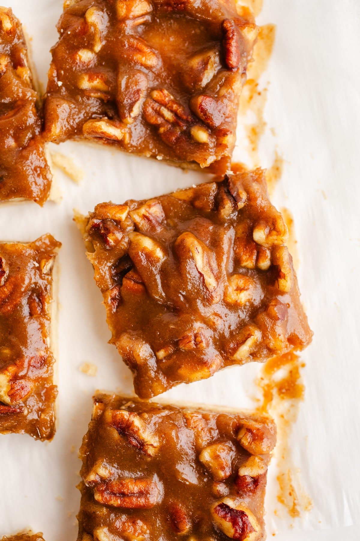 Pecan bars on parchment paper.