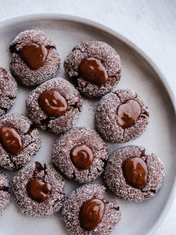 Cookies with chocolate centers on a plate.