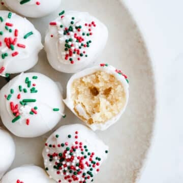 Sugar cookie balls on a plate.