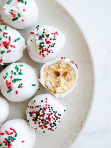 Sugar cookie balls on a plate.