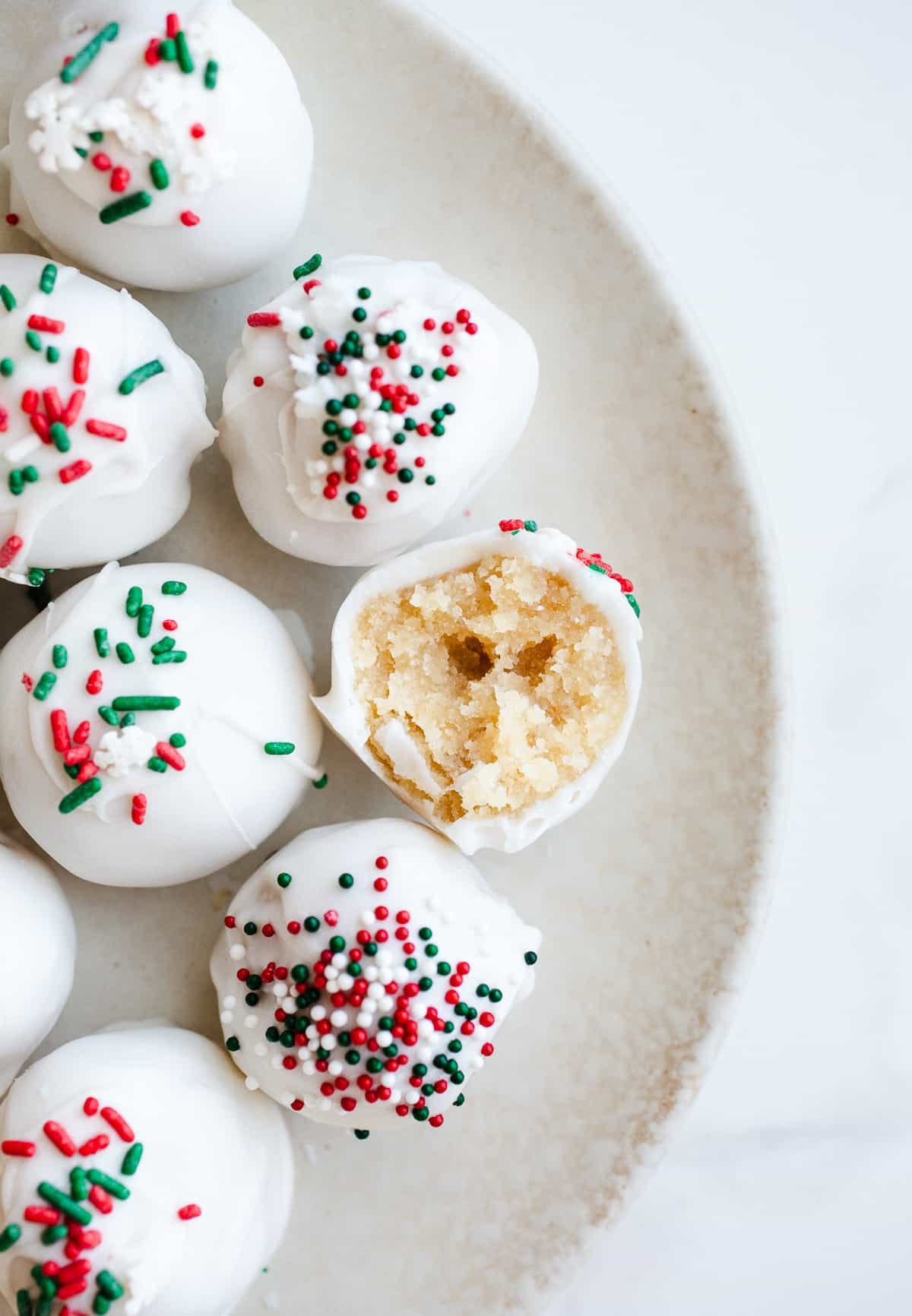 Sugar cookie balls on a plate. 