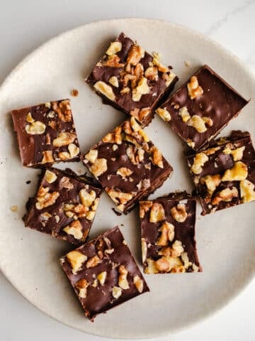 Fudge with walnuts on a plate.