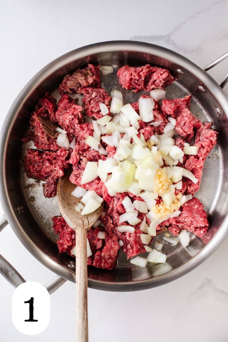 Ground beef and onion in a skillet. 