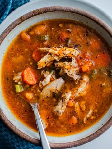 Soup in a bowl with a spoon.