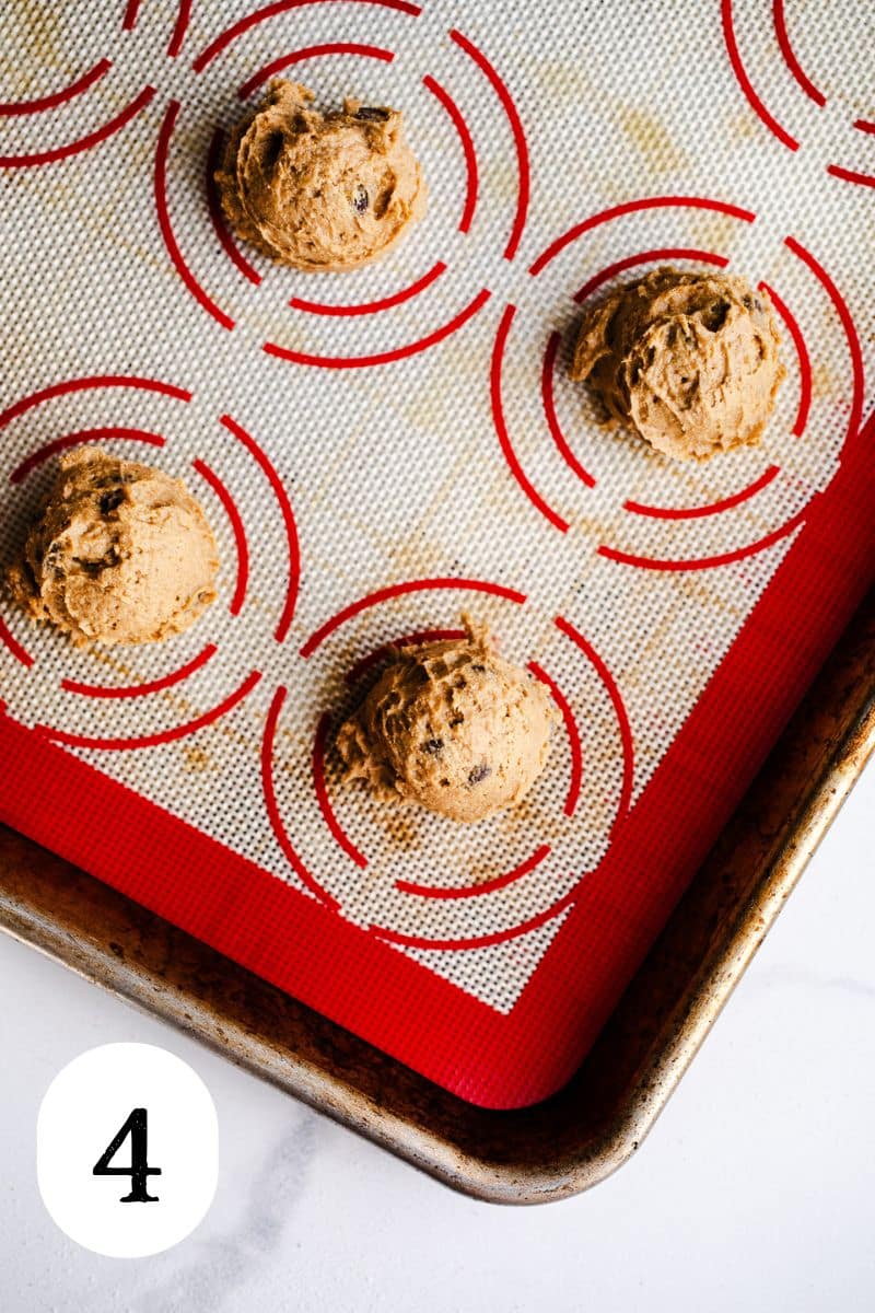 Cookie dough balls on a baking sheet. 