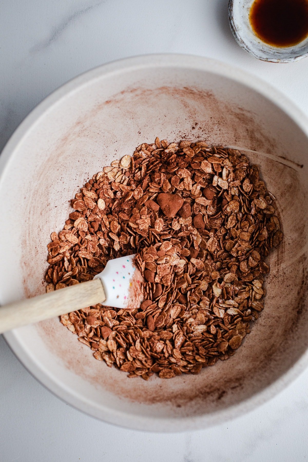 Cocoa and oats in a mixing bowl.