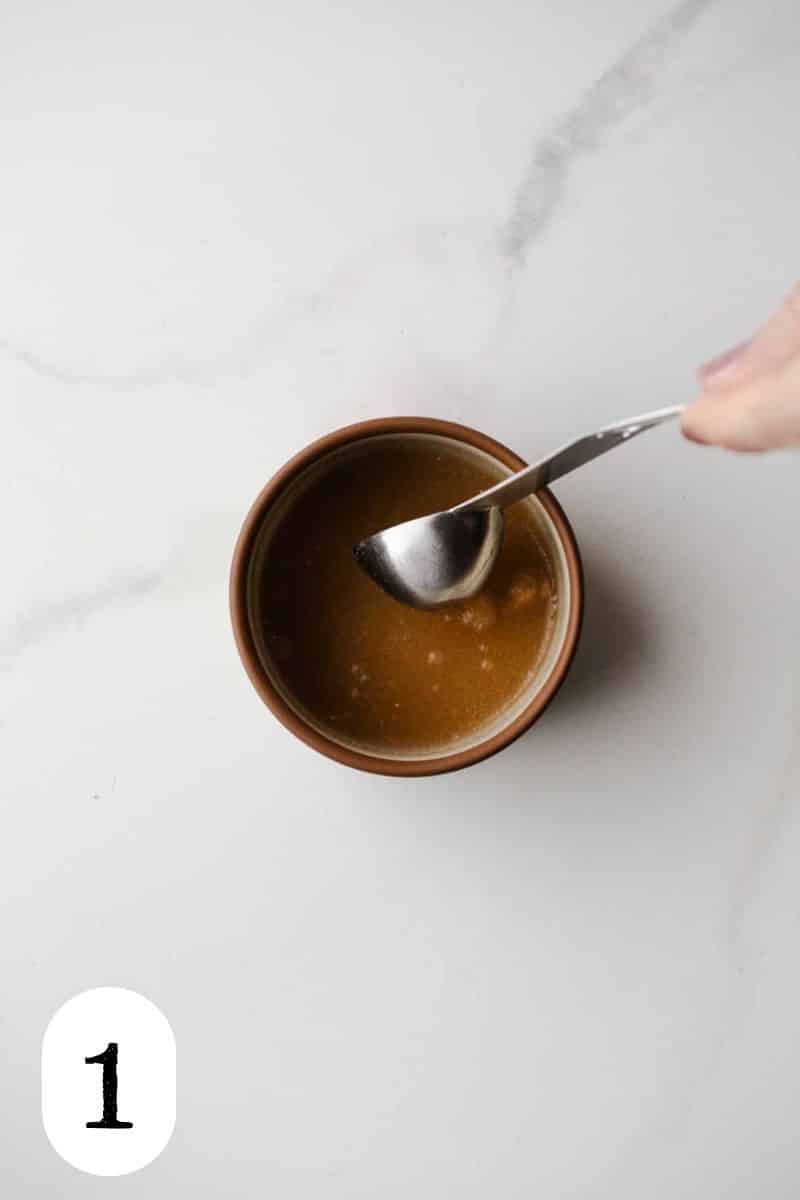 Psyllium husk powder in a small bowl with water. 
