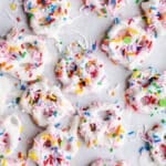 White chocolate pretzels on parchment paper.