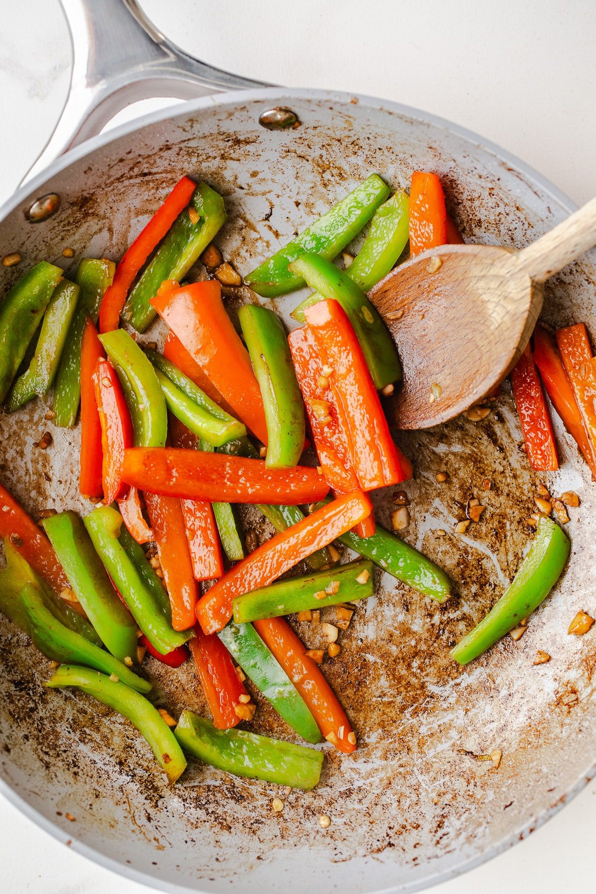 Bell peppers in a skillet.