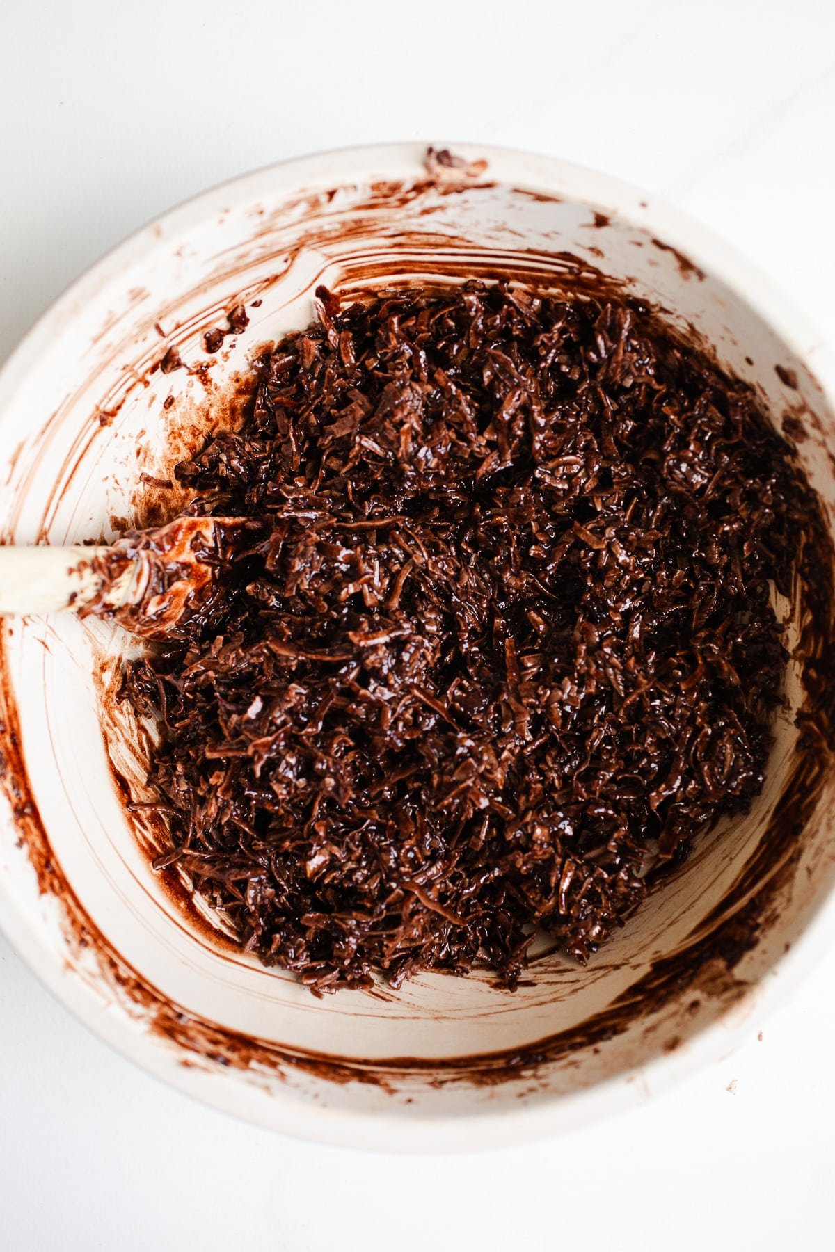 Chocolate coconut mixture in a bowl.