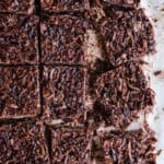 Coconut chocolate bars on parchment paper.