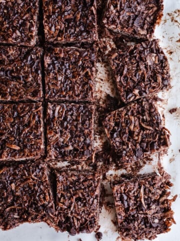 Coconut chocolate bars on parchment paper.