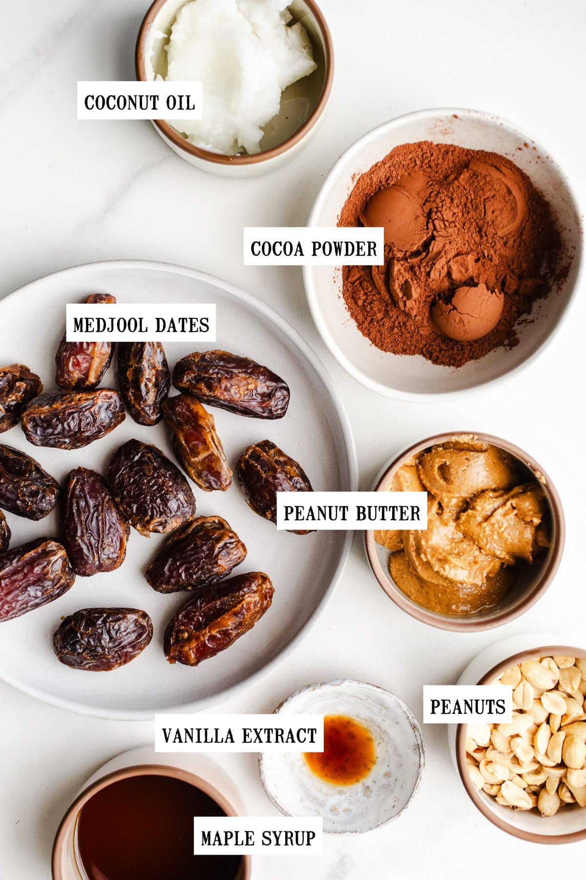 Ingredients in small bowls to make date snickers.