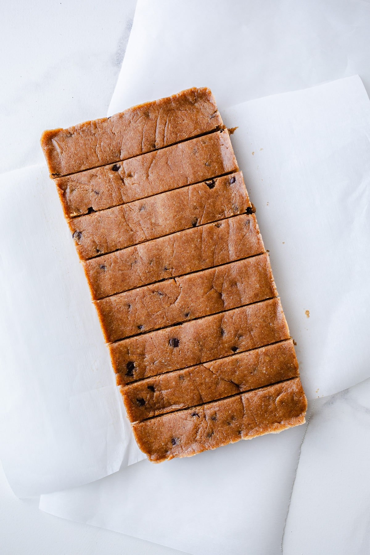 Gluten-free dairy-free protein bars on parchment paper.