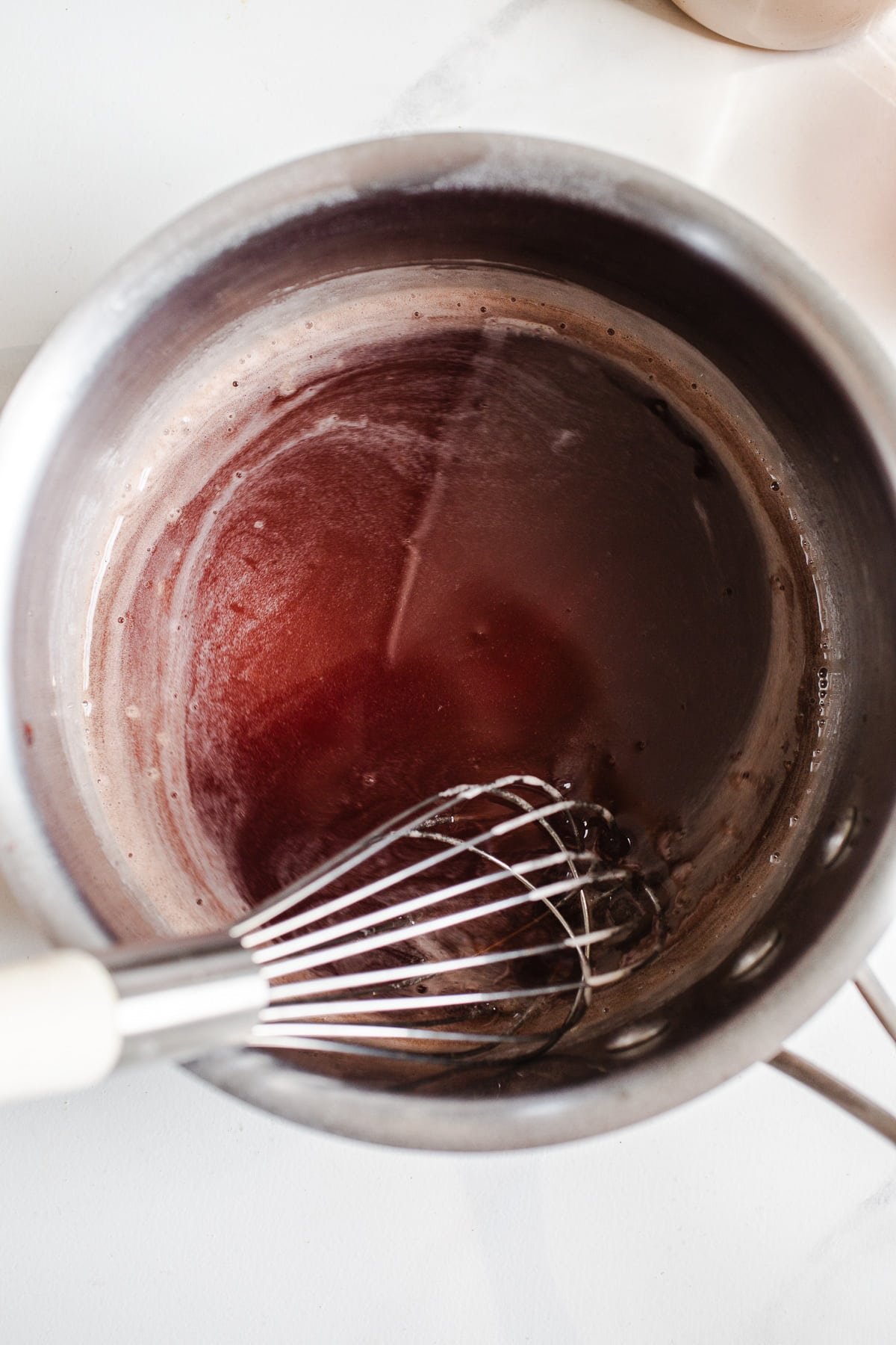Blueberry juice in a saucepan.