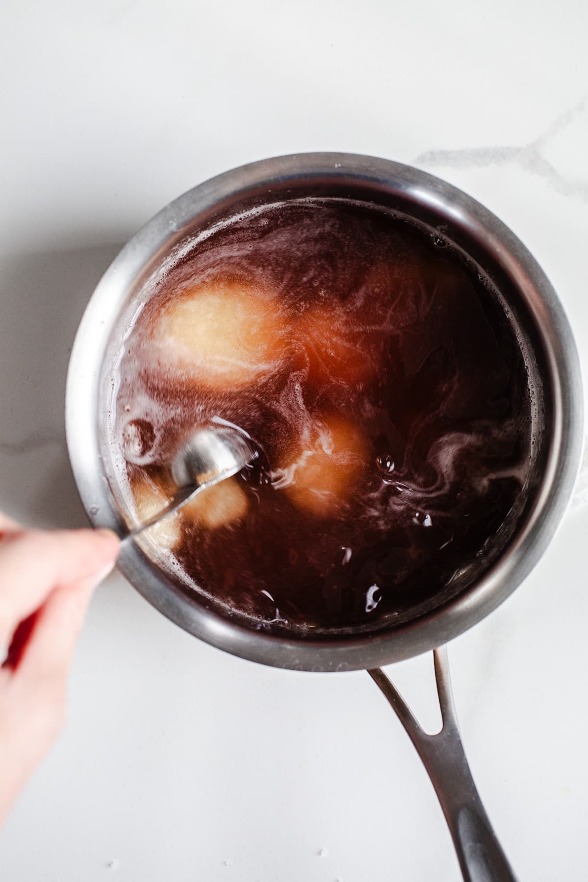Gelatin and blueberry juice in a saucepan.