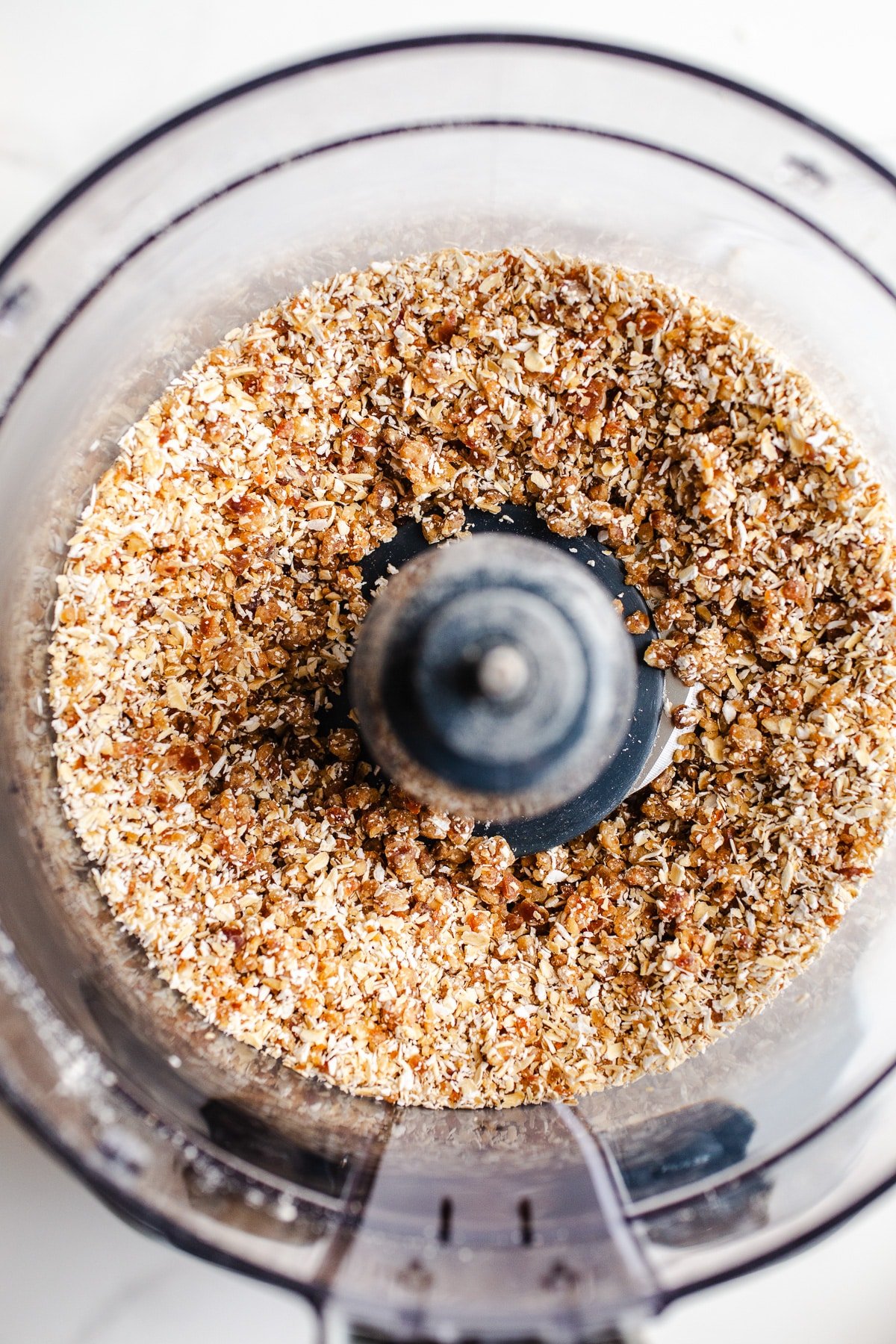 Nuts and dates in a food processor. 