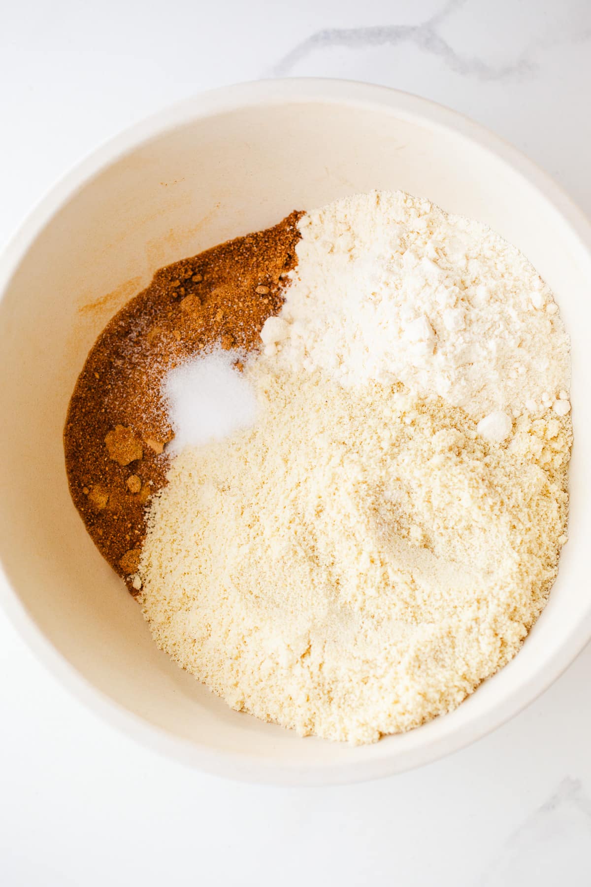 Almond flour and coconut sugar in a mixing bowl.