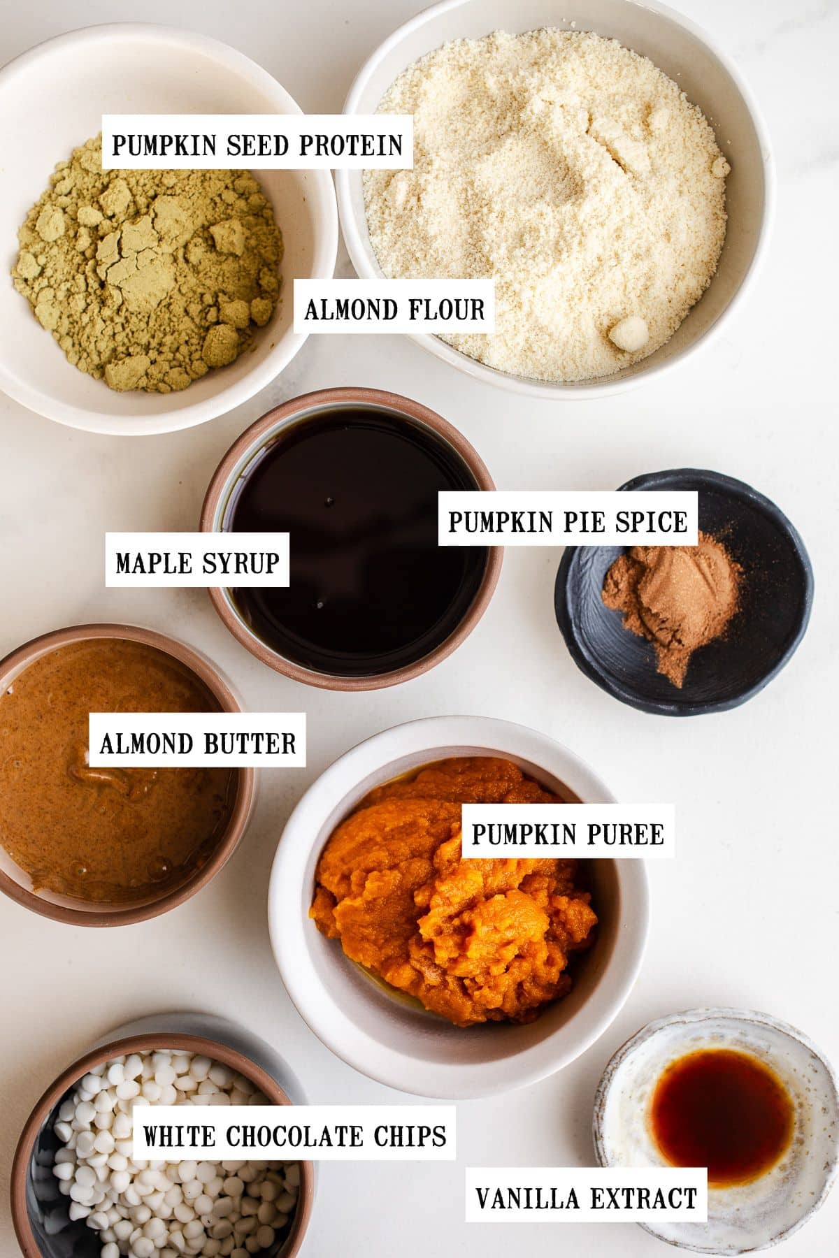 Small bowls of ingredients for pumpkin bars. 