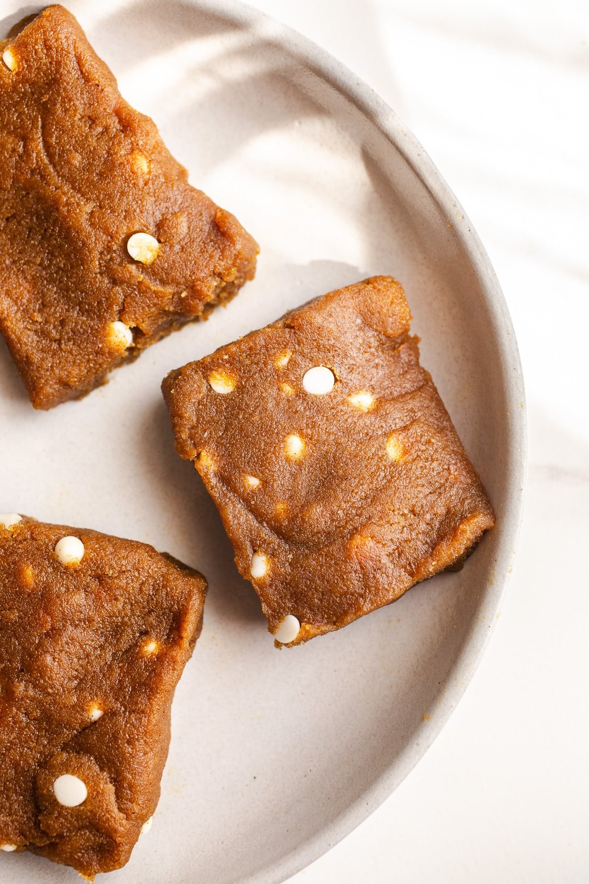 Pumpkin bars on a white plate. 