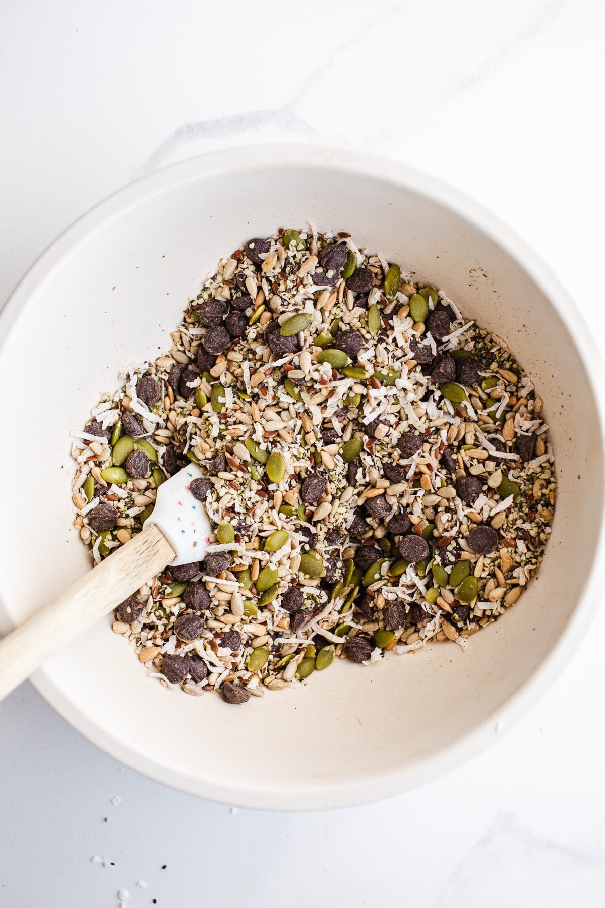 A mixing bowl filled with seeds.