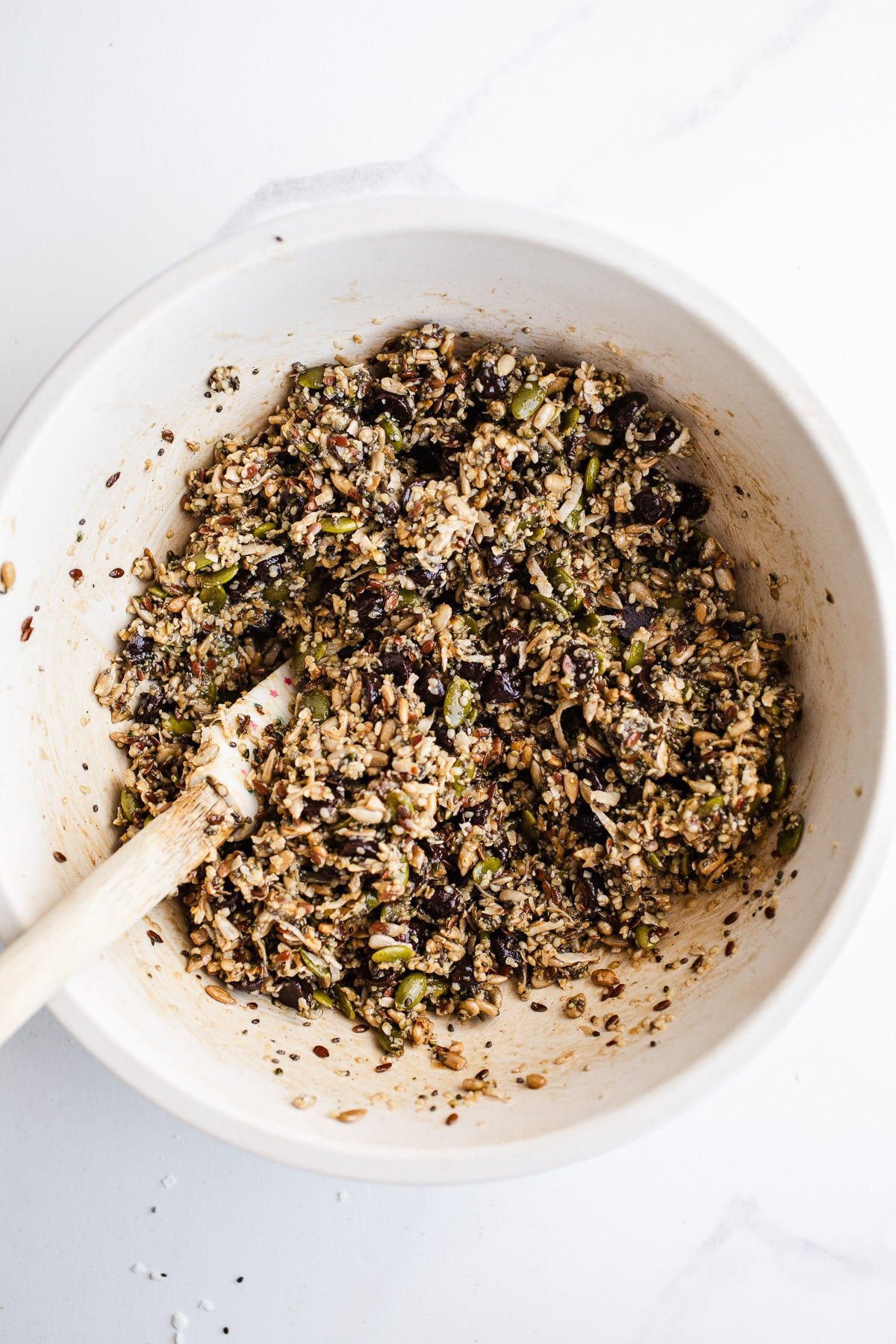 Seeds and chocolate chips in a mixing bowl.