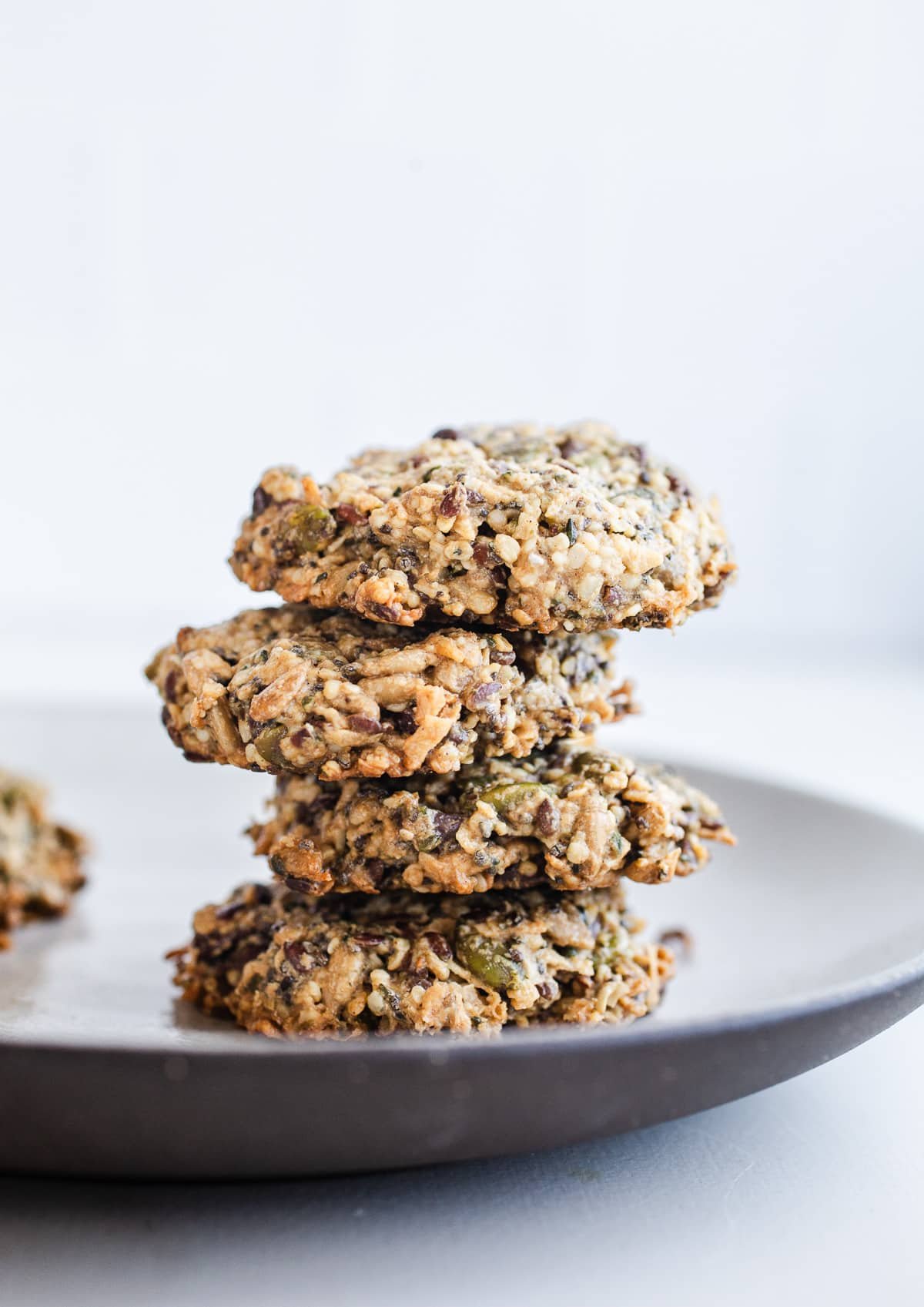 A stack of seed cookies on a plate. 