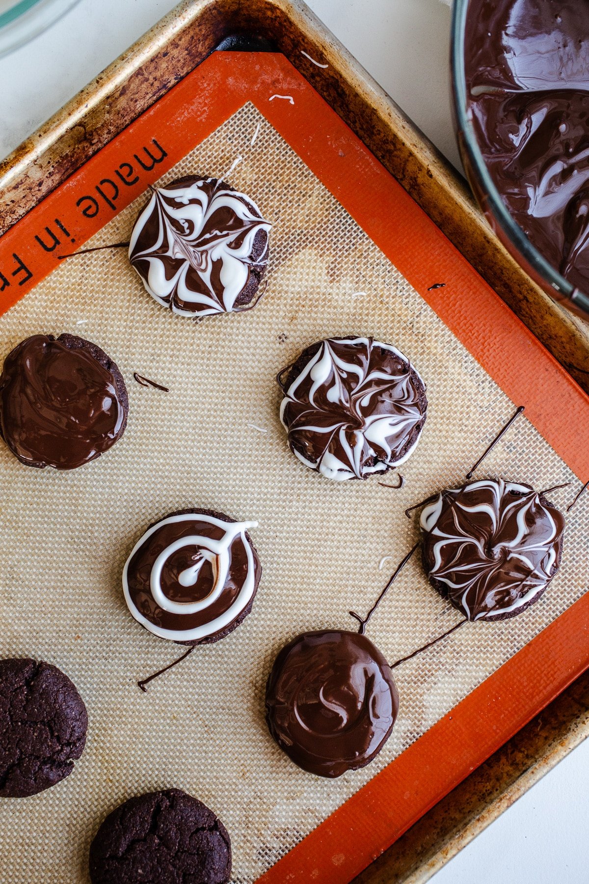 Chocolate cookies glazed with chocolate and white chocolate.