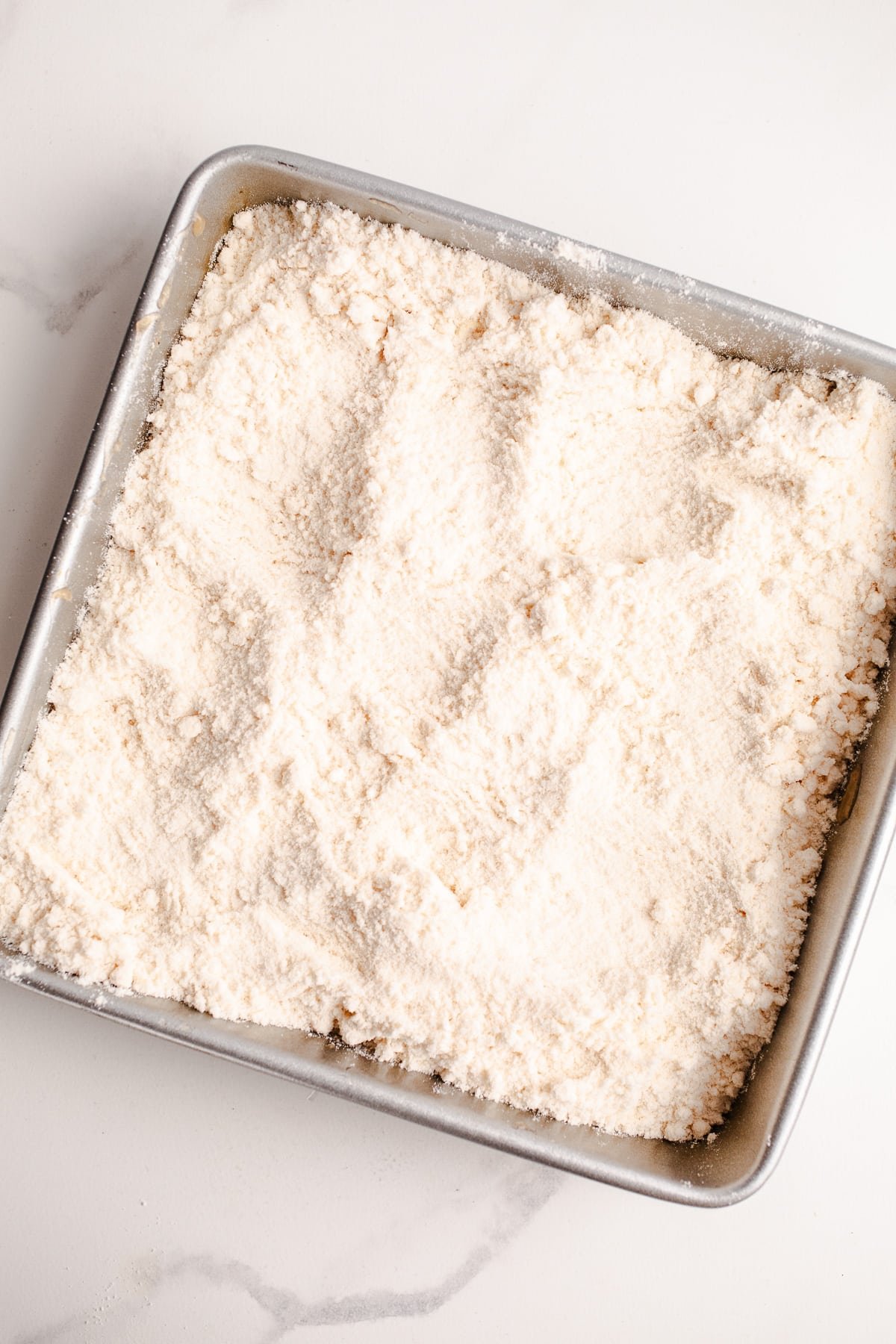 Cake mix in a baking pan.